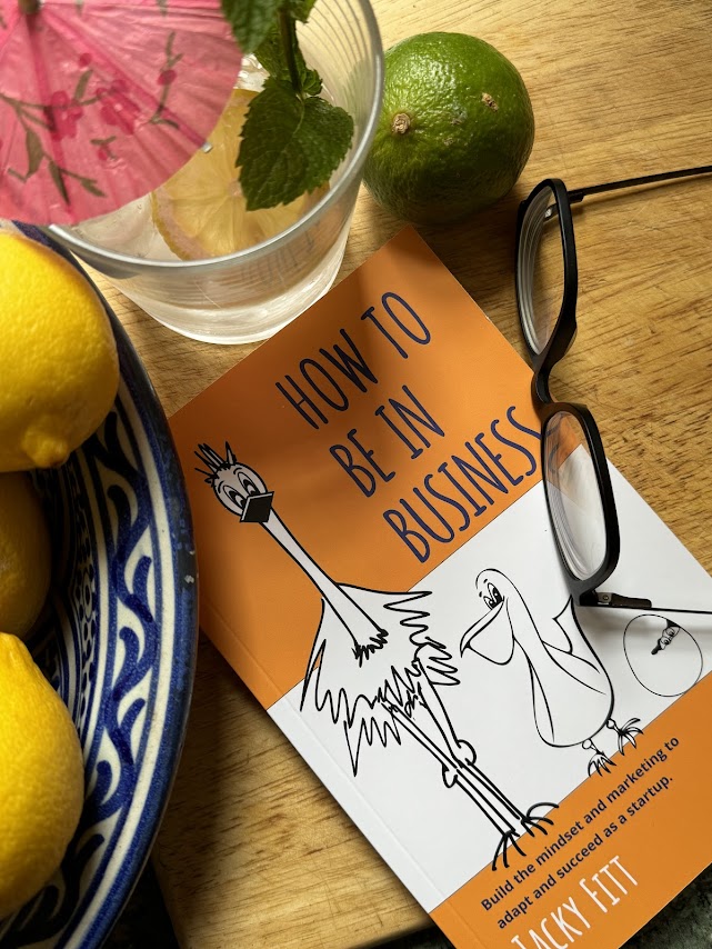 'How to Be In Business' book with cocktail and fruit bowl | summer reading giveaway 2024